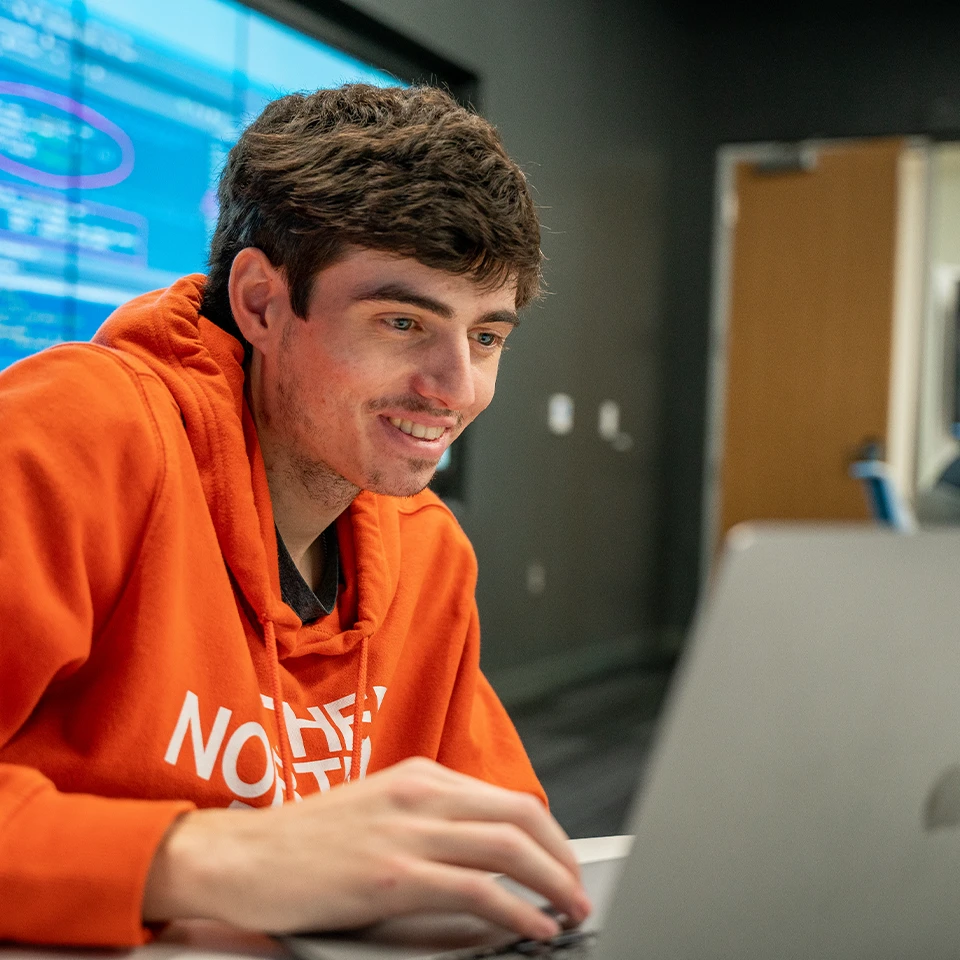 student in data visualization lab for data analytics major