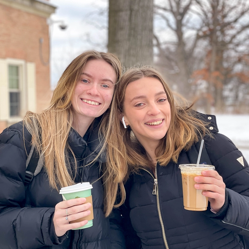 Students keeping warm on campus with their favorite drinks