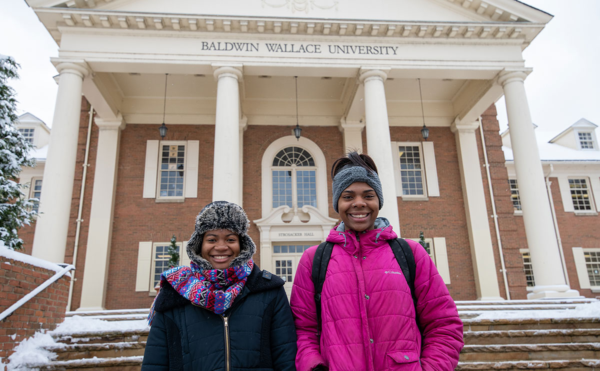 Students in front of Strosacker Hall in winter