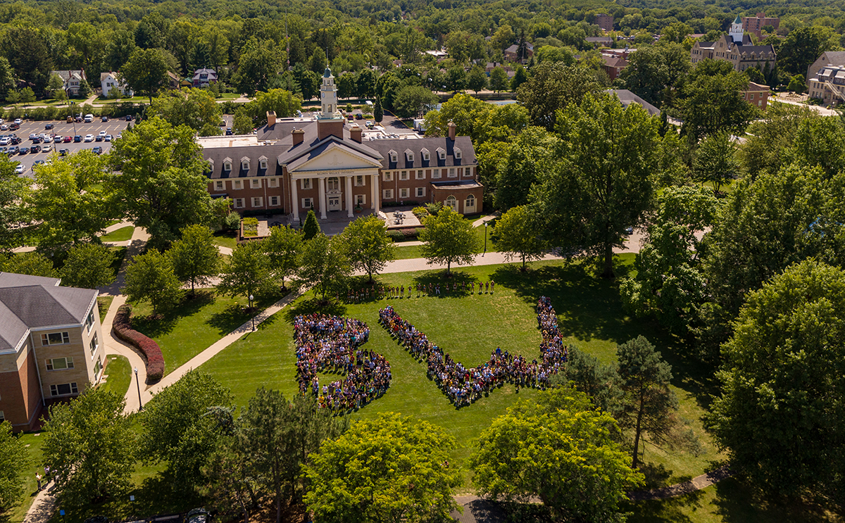 Aerial of students spelling out BW in front of Strosacker Hall