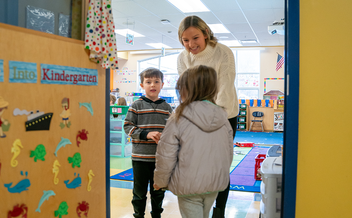 student teacher greets students