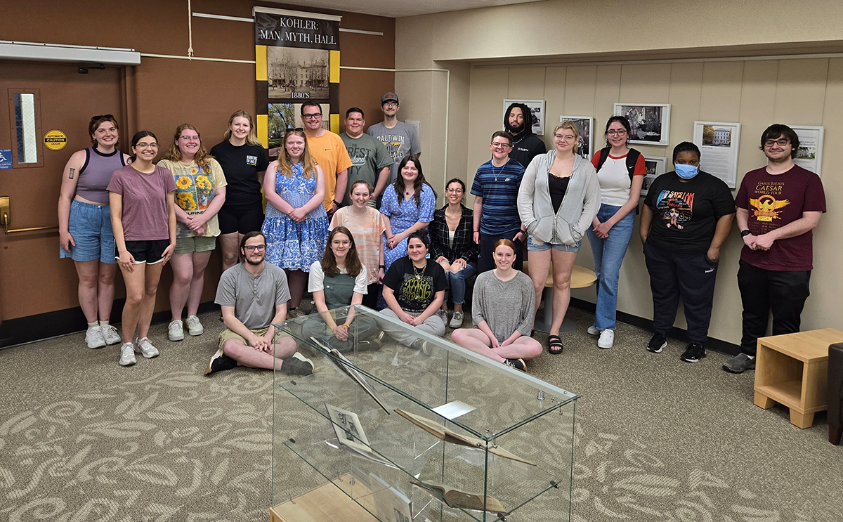 Students by an exhibit on Kohler Hall