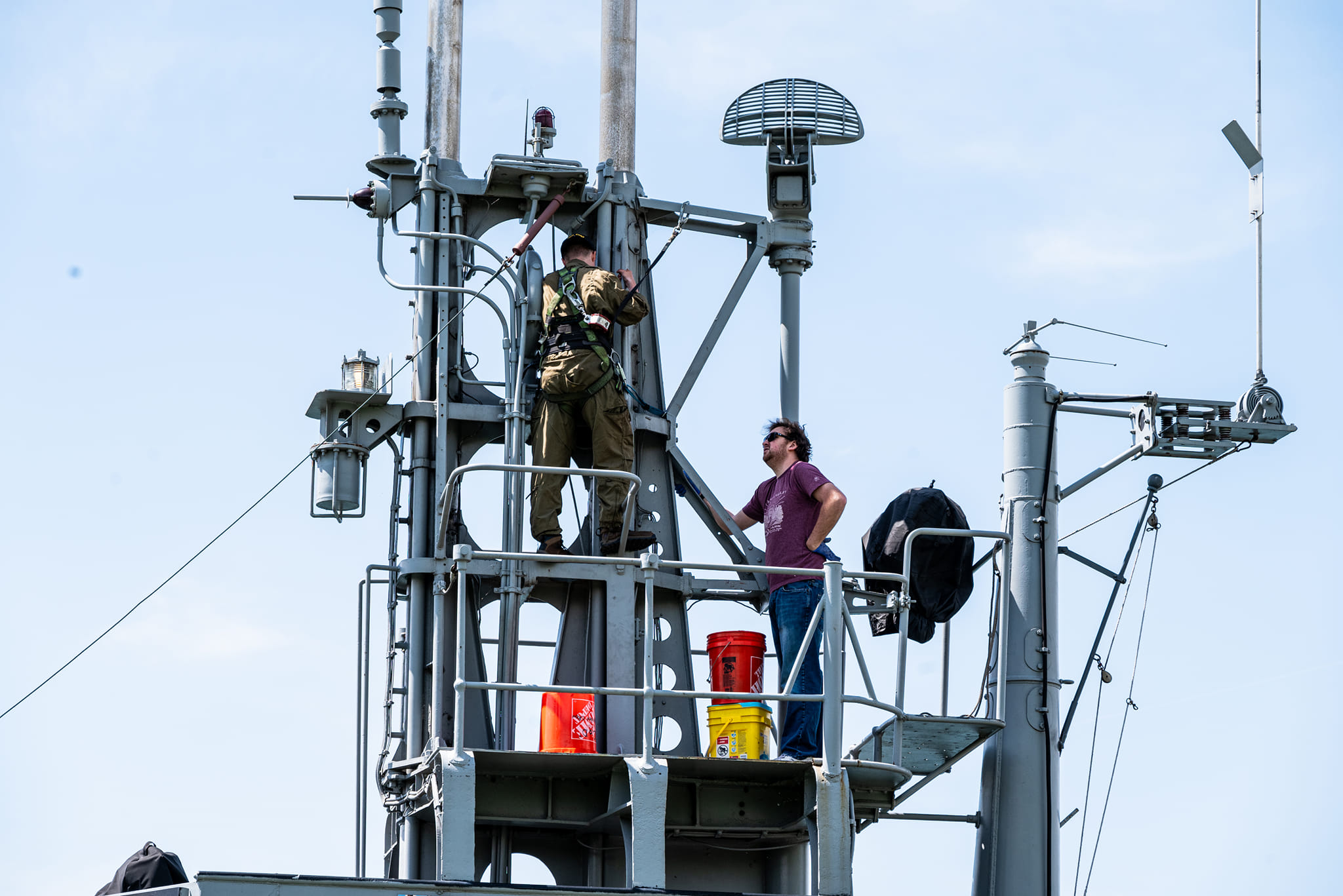 A body harness allows curator Ben Yanke to safely work on the Cod’s periscope.